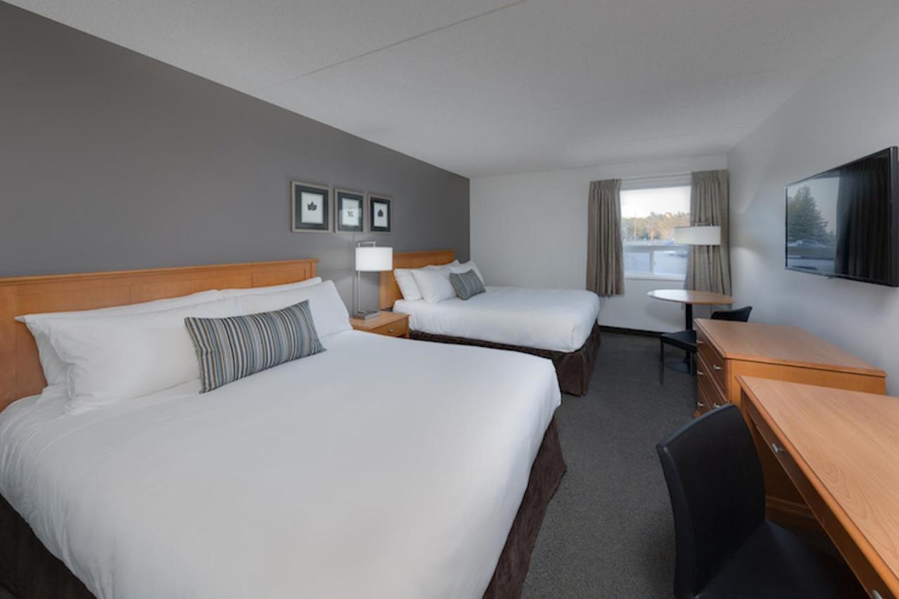 Heritage Inn Hotel & Convention Centre - Муус Джоу Екстериор снимка